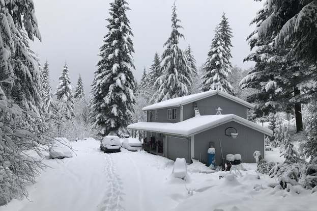 a home in Scappoose, Oregon, covered in snow during winter