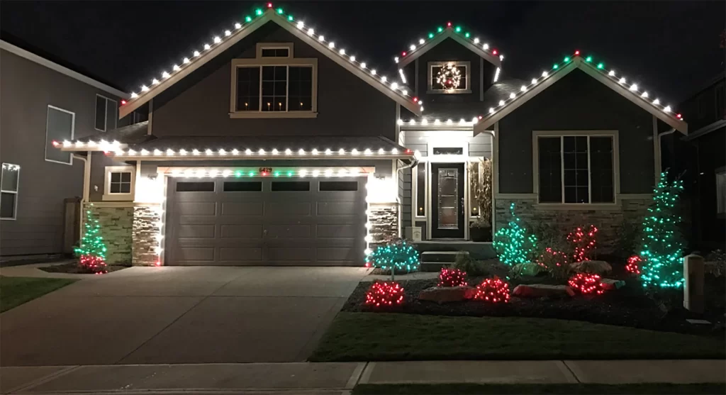 home decorated with christmas lights. Learn how to hang christmas lights on gutters