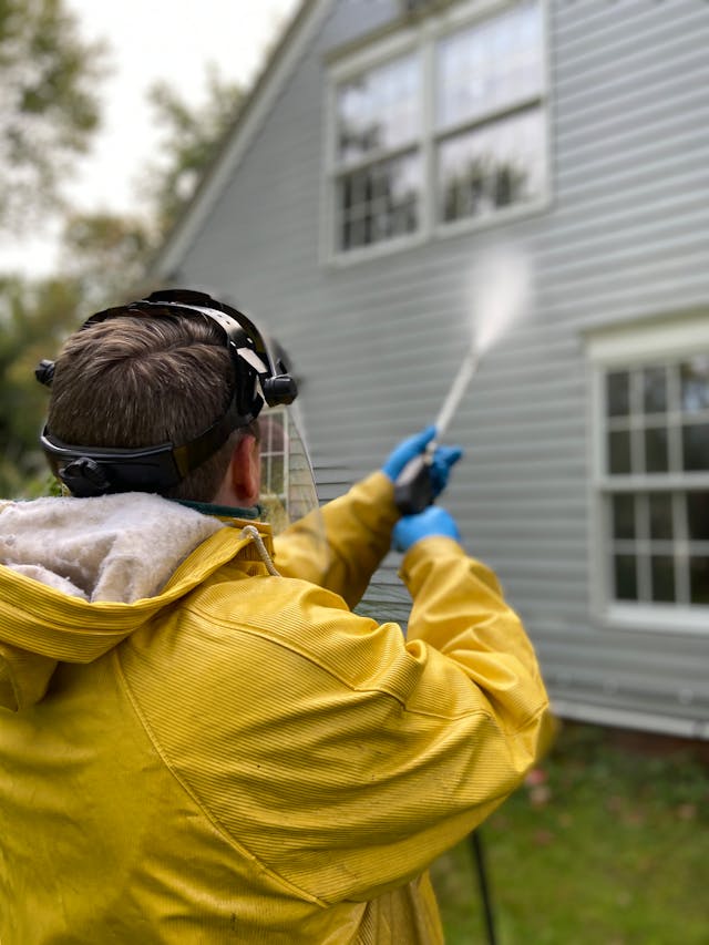 House Washing Beaverton 1 man pressure washing a home
