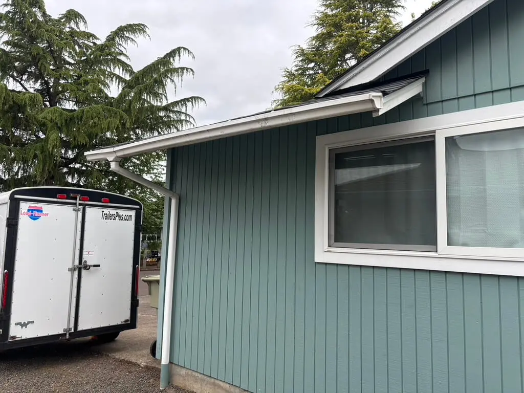 Gutter Cleaning Beaverton 6 a photo of clean white gutters on a home in